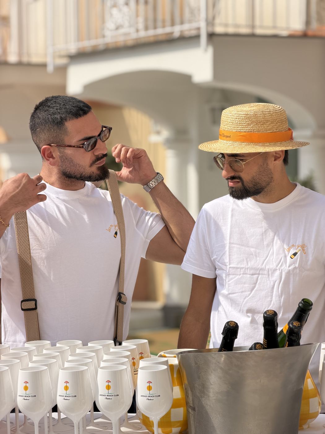 Two Solé servers preparing the glasses before the doors open